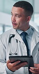 Doctor, man and tablet with discussion, team and problem solving with medical career at hospital. People, group and healthcare professional with application, report or review with solution at clinic