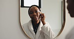 Mirror, bathroom and black woman with cotton pad for skincare, beauty and facial cleanse in home. Morning routine, dermatology and happy person with patch for cleaning, grooming and makeup removal