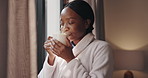 Hotel, aroma and black woman with coffee for relax on holiday, vacation and hospitality. Resort, tea and person smell drink for peace, calm and enjoying scent with steam for happiness by window