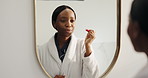 Mirror, lipstick and black woman in bathroom, makeup and cosmetics with routine, pride and confidence. African person, home and beauty treatment with reflection, grooming and morning with skincare