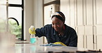 Woman, spray and wipe counter in kitchen for surface disinfection, dust removal or spring cleaning. Happy maid, black person or gloves in home for domestic chores, household maintenance or sanitation