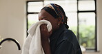 Smelling, material and woman with chores, home or spring cleaning on weekend, fragrance and laundry. Fresh, scent and black person with routine in house, housework and hygiene for fabric and cloth