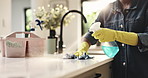 Hands, spray and wipe counter in kitchen for surface disinfection, dust removal or germ protection. Cleaning service, person or gloves in home for domestic chores, household maintenance or sanitation