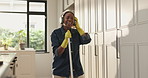 Broom, headphones and black woman sing in home for cleaning, floor maintenance and hygiene in living room. Happy, apartment and person listen to music for housekeeping, dust prevention and sweeping
