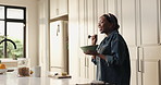 Breakfast, dance and black woman in kitchen with nutrition, energy or healthy diet with bowl. Food, excited person or music in home for freedom, wellness or singing for meal prep with morning routine