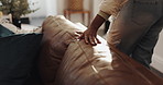 Hands, cleaning living room and sofa in home with complete task, happy and tidy for vacation rental. Person, realtor and neat with couch, pride and accommodation services in lounge at holiday house