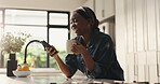Woman, texting and smartphone in kitchen, coffee and smile for communication with contact or online. Happy, black person and chat on social media in home, mobile or caffeine in morning, tea and house