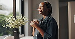 Happy, woman and coffee in morning, home or smile with hot beverage in kitchen, calm or daydreaming. Reflection, peace and black person with caffeine in house, relax and break on weekend or memory