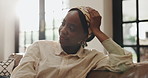 Black woman, thinking and relax on couch with smile, comfort and stress free in living room. Memory, female person and reflection in home with good mood, day dreaming and peace with satisfaction