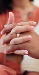 Couple, hands and marriage with ring for loyalty, vow or commitment together in home. Closeup, man and woman with touch, finger jewelry or trust for romantic partnership, love or support in house