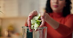 Woman, hands and apple with blender in kitchen for fruit smoothie, health or weight loss in home. Closeup, female person or nutritionist with natural organic ingredients or recipe for nutrition diet