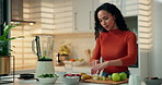 Blender, woman and cutting apples in kitchen for breakfast shake, meal replacement or prepare drink. Smoothie, person or ingredients in home for organic recipe, healthy beverage and wellness benefits