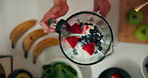 Woman, hands and mixing fruit in blender for healthy smoothie, breakfast drink or meal replacement. Above, person and prepare organic shake in home for nutrition, vitamin benefits or digestive health