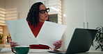 Woman, finance and documents with laptop in kitchen for tax, debit order or statement in home. Female person, accounting and paperwork with computer for financial planning, expenses or bills in house