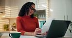 Woman, laptop and finance documents in home with review, budget and report for bills in kitchen. Person, computer and paperwork for asset management, loan and reading info for tax compliance at house
