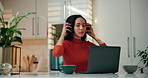 Laptop, music and remote work with woman in kitchen of home for morning research or streaming. Computer, headphones and smile of happy freelance entrepreneur in apartment for listening or planning