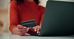 Woman, hands and laptop with credit card for online shopping, payment or purchase in home. Closeup, female person or shopper with debit or computer for virtual transaction or remote banking in house