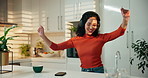 Headphones, dancing and woman in kitchen, smartphone and smile with energy, sound and connection. Home, headset or happy person with cellphone, movement and listening to music, radio or app for audio