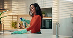 Happy woman, dancing and cleaning with headphones in kitchen for hygiene or disinfection in home. Female person, housewife and wiping surface with music or gloves for housekeeping or chores in house
