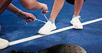 Padel tennis, hands and tying shoes with laces for match preparation, sport or team game. Closeup, people and tie sneakers with balance, challenge or getting ready in court or club for performance