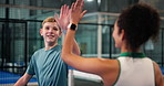 Padel tennis, boy and coach with high five for success, approval and learning at sports club. Training, support and motivation for game lesson, fitness and celebration with woman and child in court