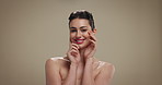 Beauty, cosmetics and face of happy woman on studio background for dermatology results or satisfaction. Aesthetic, skincare and touching with smile of model on space for facial treatment or wellness