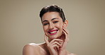 Beauty, face and touching with happy woman on studio background for cosmetic results or satisfaction. Aesthetic, dermatology and skincare with smile of model on space for facial treatment or wellness
