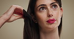 Hair care, beauty and woman with comb in studio for texture, growth or health. Hairstyle, cosmetics and model with tool for grooming routine, salon or natural oil distribution for shine on background