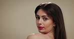 Face, woman and touch for skincare in studio background of healthy skin, texture glow and hydration. Female person, beauty and long hair with facial shine, treatment wellness and dermatology benefits