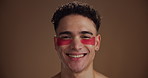 Face, eye patches and man with skincare, smile and cosmetics on brown studio background. Portrait, space and happy person with dermatology, spa wellness and grooming with routine, beauty and detox