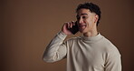 Studio background, phone call and man with smile, talking or communication with contact for campaign. Creative, entrepreneur and person with mobile for business pitch, investment opportunity or chat
