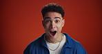 Wow, face and man with shock in studio for promo giveaway, mind blown and sale announcement. Mockup space, person and surprise on red background for unexpected news, discount deal and wtf reaction