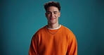 Face, man and confident for fashion in studio background with smile, trendy clothes and style. Portrait, male person and pride with casual outfit, winter apparel and good mood for positive attitude