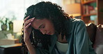 Woman, headache and stress on sofa, home and regret with mistake, anxiety or worry in living room. Person, migraine and pain with fatigue, burnout and exhausted with sad memory on couch at apartment