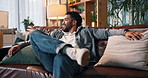 Man, relief and happy on sofa with thinking, home and relax with rest, reflection and insight in lounge. Person, smile and comfort on couch for perspective, inspiration or break in living room