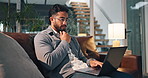 Laptop, thinking and man on sofa in home with creative career for freelance project in living room. Computer, typing and male copywriter with remote work for online article publishing in apartment.