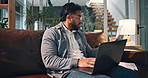 Man, laptop and finance documents in home with stress, budget and report for taxes on sofa. Person, computer and paperwork for asset management, loan and worry with crisis for bills at apartment