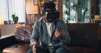 Man, VR headset and touch in metaverse on sofa, gaming or interactive video with futuristic user experience. Person, gamer and augmented reality in lounge with tech, goggles and 3D display at home