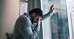 Stress, thinking and business man by window with worry for failure, job loss and bankruptcy. Office, worker and person with upset, disappointed and anxiety for finance crisis, mistake or unemployment