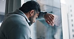 Office, thinking and businessman by window with stress for failure, job loss and bankruptcy. Burnout, worker and person with upset, frustrated and worry for finance crisis, mistake and unemployment