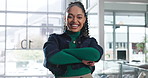 Arms crossed, face and laughing with business black woman in office for creative career as designer. Confident, funny and proud with design employee in workplace for development or job satisfaction