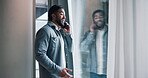 Laughing, phone call and window with reflection of man in home for comedy, conversation or humor. Communication, funny and glass with happy person speaking on mobile for good news, gossip or joke