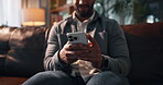Phone, typing and hands with man on sofa for communication, contact and social media. Networking, connection and swipe with person in living room of home for conversation, online forum and scroll