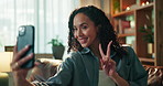 Woman, selfie and peace sign with smile on sofa, relax and post on web in living room at home. Person, influencer and photography with symbol, emoji or happy with social media on couch at apartment