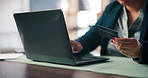 Laptop, credit card and hands of woman with online shopping, ecommerce or bonus reward in home. Debit, computer and female person with paying bills, mortgage or debt on website banking in house.