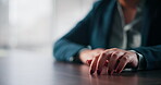 Hands, waiting and person in office, desk and impatient for court ruling, legal hearing or attorney. Closeup, criminal lawyer and anxious for decision in law firm, wooden table and constitution