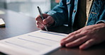 Hands, person and signature on contract for agreement, mortgage deal or title deed for compliance. Pen, paperwork and filling form for loan application, insurance policy or writing on legal document