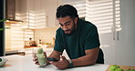 Drinking, smoothie and man with supplement, kitchen or detox with beverage, nutrition or smartphone. Morning, texting and healthy diet for person with liquid, mobile and smile for hydration in house
