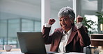 Woman, laptop and fist pump at office with smile, celebration or success with project at finance agency. Mature person, investor and happy for achievement, goals and revenue with profit at company