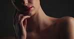 Hand, beauty and woman in studio for skincare, dermatology and self care. Model, cosmetics and makeup with aesthetic for shine, face glow and health for skin wellness isolated on black background